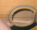 Strumming a guitar with your thumbnail